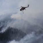 Washington helicopter surrounded by wildfire smoke